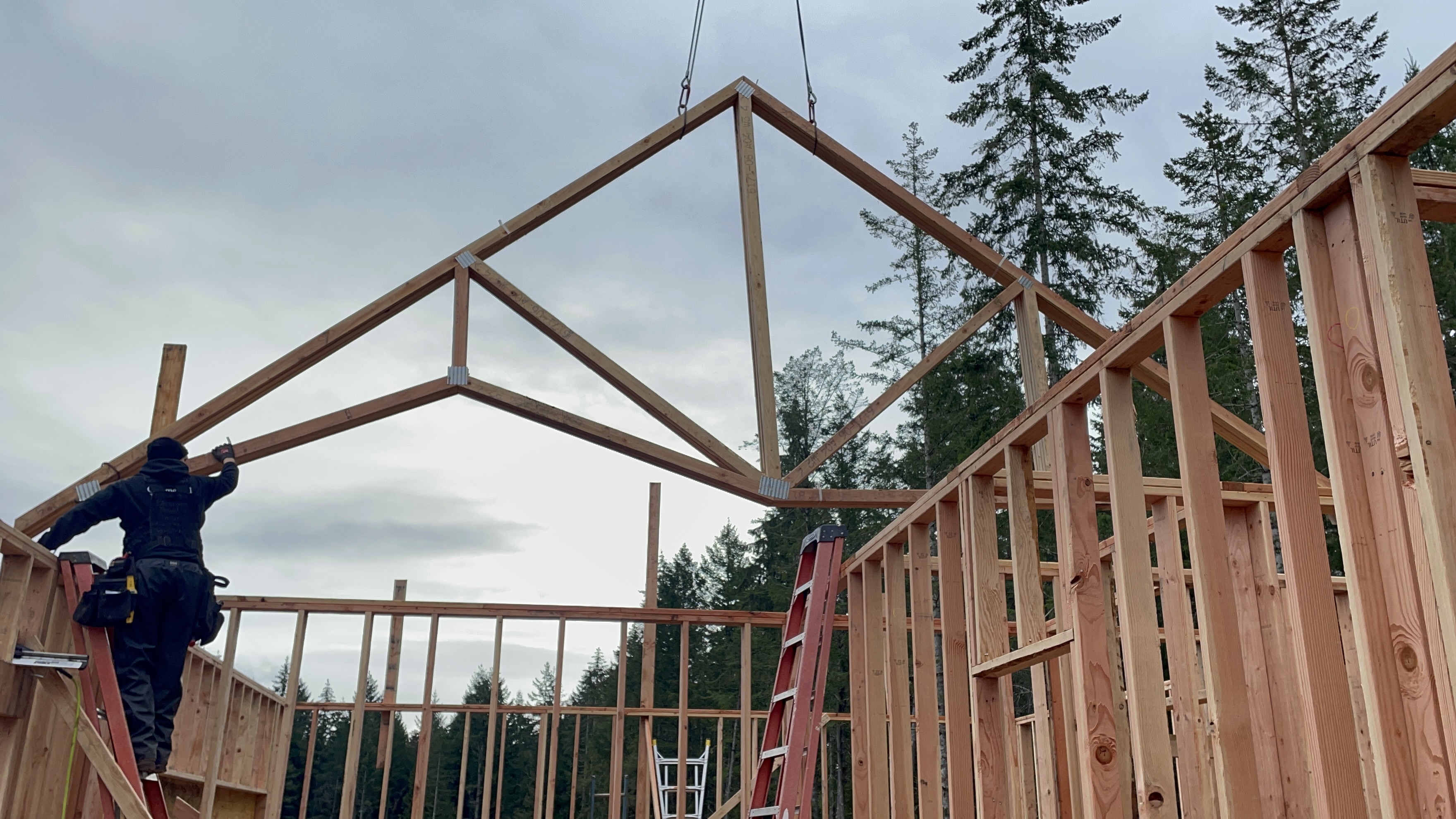 Custom home trusses being set in Mason County